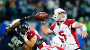 SEATTLE, WA - DECEMBER 31: Defensive end Dion Jordan #95 of the Seattle Seahawks nearly tips the ball out of the hands of quarterback Drew Stanton #5 of the Arizona Cardinals in the fourth quarter at CenturyLink Field on December 31, 2017 in Seattle, Washington. The Arizona Cardinals beat the Seattle Seahawks 26-24. (Photo by Jonathan Ferrey/Getty Images)