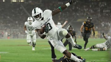 TEMPE, AZ - SEPTEMBER 08: Running back LJ Scott #3 of the Michigan State Spartans is tackled after a reception against the Arizona State Sun Devils during the first half of the college football game at Sun Devil Stadium on September 8, 2018 in Tempe, Arizona. (Photo by Christian Petersen/Getty Images)