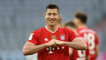 MUNICH, GERMANY - MAY 08: Robert Lewandowski of FC Bayern Muenchen celebrates after scoring their side's fifth goal during the Bundesliga match between FC Bayern Muenchen and Borussia Moenchengladbach at Allianz Arena on May 08, 2021 in Munich, Germany. Sporting stadiums around Germany remain under strict restrictions due to the Coronavirus Pandemic as Government social distancing laws prohibit fans inside venues resulting in games being played behind closed doors. (Photo by Alexander Hassenstein/Getty Images)