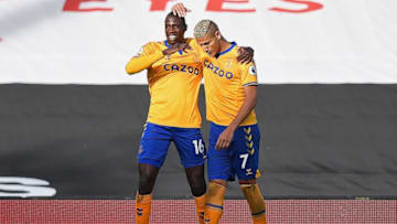 Everton's French midfielder Abdoulaye Doucoure (L) celebrates scoring his team's third goal with Everton's Brazilian striker Richarlison during the English Premier League football match between Fulham and Everton at Craven Cottage in London on November 22, 2020. (Photo by DANIEL LEAL-OLIVAS / POOL / AFP) / RESTRICTED TO EDITORIAL USE. No use with unauthorized audio, video, data, fixture lists, club/league logos or 'live' services. Online in-match use limited to 120 images. An additional 40 images may be used in extra time. No video emulation. Social media in-match use limited to 120 images. An additional 40 images may be used in extra time. No use in betting publications, games or single club/league/player publications. / (Photo by DANIEL LEAL-OLIVAS/POOL/AFP via Getty Images)