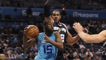 Nov 23, 2016; Charlotte, NC, USA; Charlotte Hornets guard Kemba Walker (15) looks to pass the ball during the first half of the game against the San Antonio Spurs at the Spectrum Center. Mandatory Credit: Sam Sharpe-USA TODAY Sports