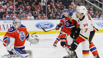 Oct 12, 2016; Edmonton, Alberta, CAN; Edmonton Oilers goaltender Cam Talbot (33) makes a save on Calgary Flames defensemen TJ Brodie (7) during the third period at Rogers Place. Mandatory Credit: Perry Nelson-USA TODAY Sports
