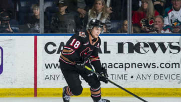 KELOWNA, BC - FEBRUARY 17: Riley Stotts #18 of the Calgary Hitmen skates with the puck against the Kelowna Rockets at Prospera Place on February 17, 2020 in Kelowna, Canada. Stotts was selected in the 2018 NHL entry draft by the Toronto Maple Leafs. (Photo by Marissa Baecker/Getty Images)