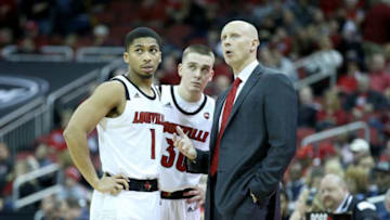 LOUISVILLE, KY - NOVEMBER 13: Chris Mack the head coach of the Louisville Cardinals talks with Christen Cunningham #1 and Ryan McMahon #30 against the Southern Jaguars at KFC YUM! Center on November 13, 2018 in Louisville, Kentucky. (Photo by Andy Lyons/Getty Images)