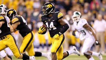 INDIANAPOLIS, IN - DECEMBER 05: Desmond King #14 of the Iowa Hawkeyes returns a kick against the Michigan State Spartans in the Big Ten Championship at Lucas Oil Stadium on December 5, 2015 in Indianapolis, Indiana. (Photo by Andy Lyons/Getty Images)