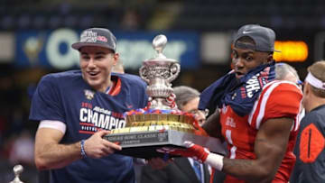 Jan 1, 2016; New Orleans, LA, USA; Mississippi Rebels quarterback Chad Kelly and Mississippi Rebels wide receiver Laquon Treadwell (1) hold the trophy at the end of the 2016 Sugar Bowl at the Mercedes-Benz Superdome. Mississippi defeated the Oklahoma State Cowboys, 48-20. Mandatory Credit: Chuck Cook-USA TODAY Sports