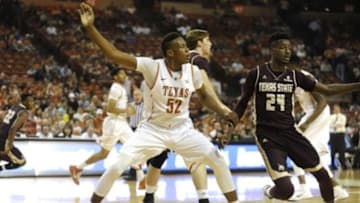 Dec 13, 2014; Austin, TX, USA; Texas Longhorns forward Myles Turner (52) fights for position against Texas State Bobcats forward Cameron Naylor (24) during the second half at the Frank Erwin Special Events Center. Texas beat Texas State 59-27. Mandatory Credit: Brendan Maloney-USA TODAY Sports