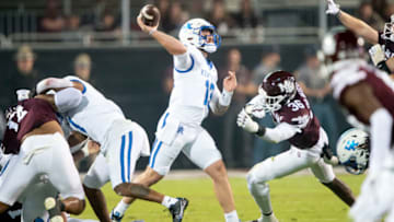 STARKVILLE, MISSISSIPPI - NOVEMBER 04: Quarterback Devin Leary #13 of the Kentucky Wildcats looks to throw a pass in front of defensive lineman Donterry Russell #36 of the Mississippi State Bulldogs during the first half of play at Davis Wade Stadium on November 04, 2023 in Starkville, Mississippi. (Photo by Michael Chang/Getty Images)