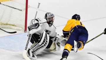 Mar 21, 2016; Nashville, TN, USA; Nashville Predators center Mike Fisher (12) dives to score past Los Angeles Kings goalie Jonathan Quick (32) during the second period at Bridgestone Arena. Mandatory Credit: Christopher Hanewinckel-USA TODAY Sports