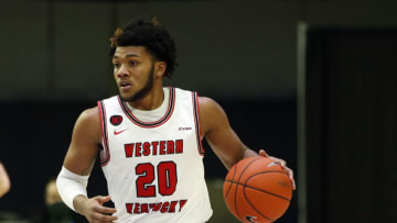 Mar 13, 2021; Frisco, TX, USA; Western Kentucky Hilltoppers guard Dayvion McKnight (20) dribbles up court during the second half against the North Texas Mean Green at Ford Center at The Star. Mandatory Credit: Tim Heitman-USA TODAY Sports