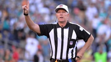 Nov 13, 2016; San Diego, CA, USA; referee Terry McAulay (77) announces a penalty during the second half of the game between the San Diego Chargers and Miami Dolphins at Qualcomm Stadium. Miami won 31-24. Mandatory Credit: Orlando Ramirez-USA TODAY Sports