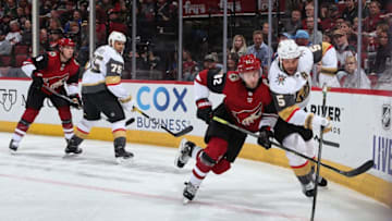 GLENDALE, ARIZONA - OCTOBER 10: Deryk Engelland #5 of the Vegas Golden Knights and Jordan Oesterle #82 of the Arizona Coyotes skate for the puck during the second period of the NHL game at Gila River Arena on October 10, 2019 in Glendale, Arizona. (Photo by Christian Petersen/Getty Images)