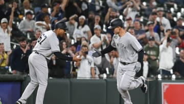 May 16, 2022; Baltimore, Maryland, USA; New York Yankees first baseman Anthony Rizzo (48) celebrates with third base coach Luis Rojas (67) after hitting a ninth inning home run against the Baltimore Orioles at Oriole Park at Camden Yards. Mandatory Credit: Tommy Gilligan-USA TODAY Sports