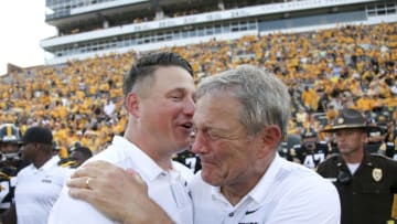 IOWA CITY, IOWA- SEPTEMBER 01: Head coach Kirk Ferentz of the Iowa Hawkeyes tears up as he is congratulated by his son, offensive coordinator Brian Ferentz after the match-up against the Northern Illinois Huskies on September 1, 2018 at Kinnick Stadium, in Iowa City, Iowa. The win made Ferentz the winningest coach in Iowa football history with 144 wins. (Photo by Matthew Holst/Getty Images)