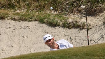 KIAWAH ISLAND, SOUTH CAROLINA - MAY 21: Dustin Johnson of the United States plays a shot from the sand on the ninth hole during the second round of the 2021 PGA Championship at Kiawah Island Resort's Ocean Course on May 21, 2021 in Kiawah Island, South Carolina. (Photo by Jamie Squire/Getty Images)