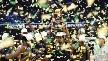 INDIANAPOLIS, INDIANA - APRIL 05: MaCio Teague #31 of the Baylor Bears holds up the trophy after defeating the Gonzaga Bulldogs 86-70 in the National Championship game of the 2021 NCAA Men's Basketball Tournament at Lucas Oil Stadium on April 05, 2021 in Indianapolis, Indiana. (Photo by Jamie Squire/Getty Images)