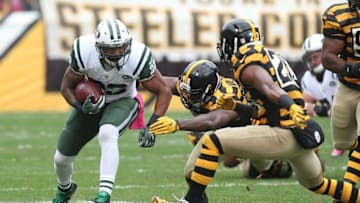 Oct 9, 2016; Pittsburgh, PA, USA; New York Jets running back Matt Forte (22) rushes the ball against Pittsburgh Steelers inside linebacker Vince Williams (98) and free safety Mike Mitchell (23) during the first quarter at Heinz Field. Mandatory Credit: Charles LeClaire-USA TODAY Sports