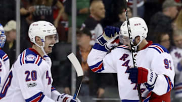 NEWARK, NJ - FEBRUARY 25: Chris Kreider #20 of the New York Rangers congratulates teammate Mika Zibanejad #93 after he secored the game winning goal in overtime against the New Jersey Devils on February 25, 2017 at Prudential Center in Newark, New Jersey.The New York Rangers defeated the New Jersey Devils 4-3 in overtime. (Photo by Elsa/Getty Images)