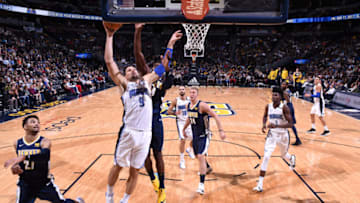 DENVER, CO - NOVEMBER 11: Nikola Vucevic #9 of the Orlando Magic goes to the basket against the Denver Nuggets on November 11, 2017 at the Pepsi Center in Denver, Colorado. NOTE TO USER: User expressly acknowledges and agrees that, by downloading and/or using this Photograph, user is consenting to the terms and conditions of the Getty Images License Agreement. Mandatory Copyright Notice: Copyright 2017 NBAE (Photo by Garrett Ellwood/NBAE via Getty Images)