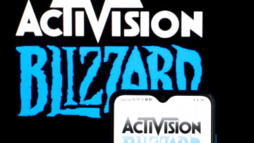 UKRAINE - 2021/09/20: In this photo illustration, Activision Blizzard, Inc. logo seen displayed on a smartphone and in the background. (Photo Illustration by Igor Golovniov/SOPA Images/LightRocket via Getty Images)