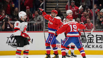 WASHINGTON, DC - JANUARY 16: Alex Ovechkin #8 of the Washington Capitals celebrates with teammate Nicklas Backstrom #19 after scoring his third goal of the game for a hat trick against the New Jersey Devils in the third period at Capital One Arena on January 16, 2020 in Washington, DC. (Photo by Patrick McDermott/NHLI via Getty Images)