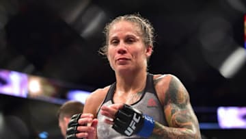 Aug 10, 2019; Montevideo, Uruguay; Liz Carmouche (blue gloves) reacts to fight against Valentina Shevchenko (red gloves) during UFC Fight Night at Antel Arena. Mandatory Credit: Jason Silva-USA TODAY Sports