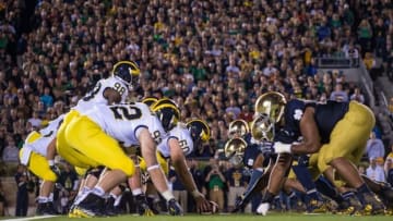 Sep 6, 2014; South Bend, IN, USA; The Michigan Wolverines and the Notre Dame Fighting Irish face off at the line of scrimmage in the third quarter at Notre Dame Stadium. Notre Dame won 31-0. Mandatory Credit: Matt Cashore-USA TODAY Sports