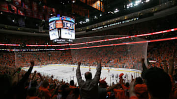 PHILADELPHIA - JUNE 02: Fans of the Philadelphia Flyers celebrate after Claude Giroux #28 of the Flyers scored a goal against Antti Niemi #31 of the Chicago Blackhawks in overtime to win 4-3 in Game Three of the 2010 NHL Stanley Cup Final at Wachovia Center on June 2, 2010 in Philadelphia, Pennsylvania. (Photo by Al Bello/Getty Images)