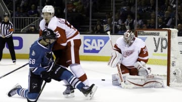 Jan 7, 2016; San Jose, CA, USA; Detroit Red Wings goalie Petr Mrazek (34) makes a save in front of San Jose Sharks right wing Melker Karlsson (68) in the third period at SAP Center at San Jose. Detroit Red Wings defeat the San Jose Sharks 2 to 1. Mandatory Credit: Neville E. Guard-USA TODAY Sports