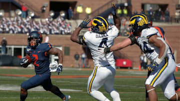 CHAMPAIGN, IL - OCTOBER 12: Reggie Corbin #2 of the Illinois Fighting Illini runs the ball as Michael Danna #4 of and Cameron McGrone #44 of the Michigan Wolverines pursues at Memorial Stadium on October 12, 2019 in Champaign, Illinois. (Photo by Michael Hickey/Getty Images)