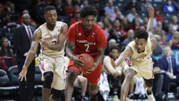 NEW YORK, NY - MARCH 07: Darius Perry #2 of the Louisville Cardinals runs with the ball against the Florida State Seminoles in the first half during the second round of the ACC Men's Basketball Tournament at Barclays Center on March 7, 2018 in New York City. (Photo by Abbie Parr/Getty Images)
