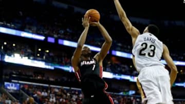 Mar 22, 2014; New Orleans, LA, USA; New Orleans Pelicans forward Anthony Davis (23) blocks a shot by Miami Heat center Chris Bosh (1) during the second half of a game at the Smoothie King Center. The Pelicans defeated the Heat 105-95. Mandatory Credit: Derick E. Hingle-USA TODAY Sports