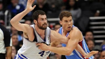 Feb. 28, 2012; Los Angeles, CA, USA; Los Angeles Clippers power forward Blake Griffin (32) defends against Minnesota Timberwolves power forward Kevin Love (42) in the second half of the game at the Staples Center. Timberwolves won 109-97. Mandatory Credit: Jayne Kamin-Oncea-USA TODAY Sports