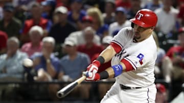 Sep 21, 2016; Arlington, TX, USA; Texas Rangers right fielder Carlos Beltran (36) hits a two run home run during the fifth inning against the Los Angeles Angels at Globe Life Park in Arlington. Mandatory Credit: Kevin Jairaj-USA TODAY Sports