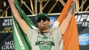 Jul 10, 2015; Las Vegas, NV, USA; Conor McGregor steps on the scale for his bout against Chad Mendes (not pictured) during weigh-ins for UFC 189 at MGM Grand Garden Arena. Mandatory Credit: Joe Camporeale-USA TODAY Sports