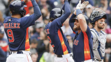 HOUSTON, TX - APRIL 08: Max Stassi #12 of the Houston Astros is congratulated by Josh Reddick #22 and Marwin Gonzalez #9 after hitting a three-run home run in the fifth inning at Minute Maid Park on April 8, 2018 in Houston, Texas. (Photo by Bob Levey/Getty Images)