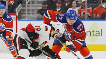 Oct 30, 2016; Edmonton, Alberta, CAN; Edmonton Oilers forward Connor McDavid (97) and Ottawa Senators forward Derick Brassard (19) battle for a loose puck during the second period at Rogers Place. Mandatory Credit: Perry Nelson-USA TODAY Sports