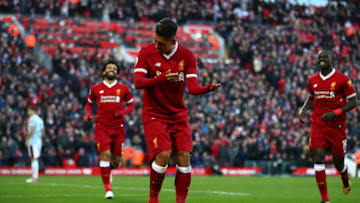 LIVERPOOL, ENGLAND - FEBRUARY 24: Roberto Firmino of Liverpool celebrates scoring his side's third goal during the Premier League match between Liverpool and West Ham United at Anfield on February 24, 2018 in Liverpool, England. (Photo by Clive Brunskill/Getty Images)
