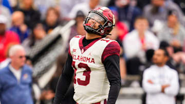 Oct 23, 2021; Lawrence, Kansas, USA; Oklahoma Sooners quarterback Caleb Williams (13) reacts after a play against the Kansas Jayhawks during the first half at David Booth Kansas Memorial Stadium. Mandatory Credit: Jay Biggerstaff-USA TODAY Sports