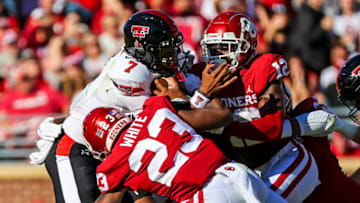 Oct 30, 2021; Norman, Oklahoma, USA; Oklahoma Sooners linebacker DaShaun White (23) and defensive back Key Lawrence (12) tackle Texas Tech Red Raiders quarterback Donovan Smith (7) during the first half at Gaylord Family-Oklahoma Memorial Stadium. Mandatory Credit: Kevin Jairaj-USA TODAY Sports