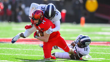 LUBBOCK, TX - NOVEMBER 18: Dylan Cantrell #14 of the Texas Tech Red Raiders is tackled by Ridwan Issahaku #31 of the TCU Horned Frogs and Jeff Gladney #12 of the TCU Horned Frogs during the first half of the game on November 18, 2017 at Jones AT&T Stadium in Lubbock, Texas. (Photo by John Weast/Getty Images)