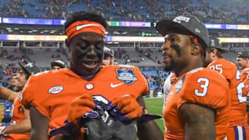 Clemson running back Travis Etienne (9) and receiver Amari Rodgers (3) celebrate a 38-3 in over Miami in the ACC football championship game in Charlotte on December 2, 2017.Clemson Miami Acc Football
