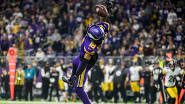 MINNEAPOLIS, MN - DECEMBER 09: Justin Jefferson #18 of the Minnesota Vikings attempts to catch the ball in the second quarter of the game against the Pittsburgh Steelers at U.S. Bank Stadium on December 9, 2021 in Minneapolis, Minnesota. (Photo by Stephen Maturen/Getty Images)
