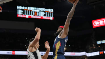 New Orleans Pelicans forward Naji Marshall (8) goes up for a dunk over San Antonio Spurs forward Zach Collins (23) Credit: Daniel Dunn-USA TODAY Sports