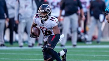 Dec 12, 2021; Charlotte, North Carolina, USA; Atlanta Falcons wide receiver Russell Gage (14) runs for yards after the catch against the Carolina Panthers during the second half at Bank of America Stadium. Mandatory Credit: Jim Dedmon-USA TODAY Sports