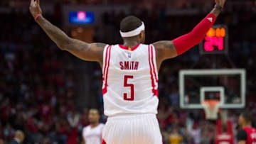 Apr 12, 2015; Houston, TX, USA; Houston Rockets forward Josh Smith (5) fires up the crowd during the second half against the New Orleans Pelicans at the Toyota Center. The Rockets defeated the Pelicans 121-114. Mandatory Credit: Jerome Miron-USA TODAY Sports