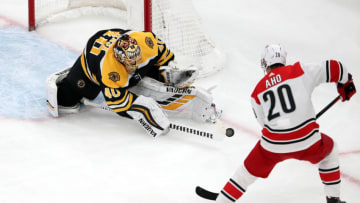 BOSTON, MASSACHUSETTS - MAY 09: Tuukka Rask #40 of the Boston Bruins makes a save against Sebastian Aho #20 of the Carolina Hurricanes during the second period in Game One of the Eastern Conference Final during the 2019 NHL Stanley Cup Playoffs at TD Garden on May 09, 2019 in Boston, Massachusetts. (Photo by Adam Glanzman/Getty Images)