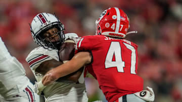 Sep 18, 2021; Athens, Georgia, USA; Georgia Bulldogs defensive back Dan Jackson (47) tackles South Carolina Gamecocks running back MarShawn Lloyd (1) during the second half at Sanford Stadium. Mandatory Credit: Dale Zanine-USA TODAY Sports