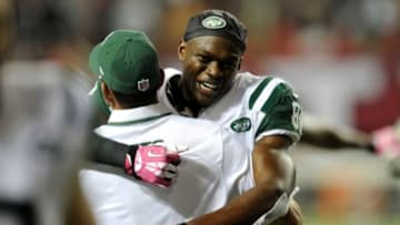 Oct 7, 2013; Atlanta, GA, USA; New York Jets wide receiver Stephen Hill (84) reacts with a coach after the Jets defeated the Atlanta Falcons at the Georgia Dome. The Jets defeated the Falcons 30-28. Mandatory Credit: Dale Zanine-USA TODAY Sports