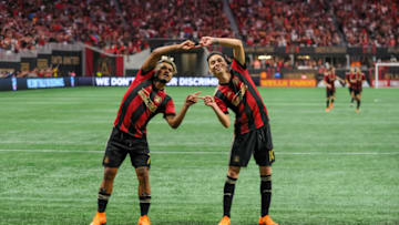 ATLANTA, GA - JUNE 30: Atlanta United midfielder Miguel Almiron (10) and Atlanta United forward Josef Martinez (7) celebrate a goal during an MLS match between the Orlando City and Atlanta United FC on June 30, 2018, at Mercedes-Benz Stadium in Atlanta, GA. (Photo by John Adams/Icon Sportswire via Getty Images)
